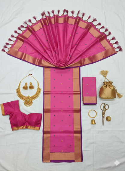 Elegant Light Pink Silk Saree with Delicate Motifs and Gold Zari Border