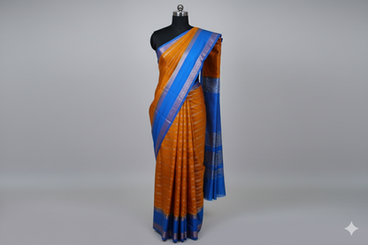 Vibrant Rust Orange Silk Saree with Bold Royal Blue Border